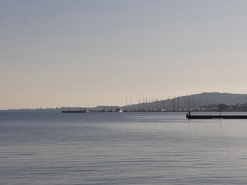 A distant view toward Kos Marina, its forest of masts visible along the shoreline south of the old town.