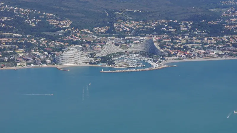 Marina Baie des Anges at Villeneuve-Loubet, the wave-shaped towers rising directly behind the berths.