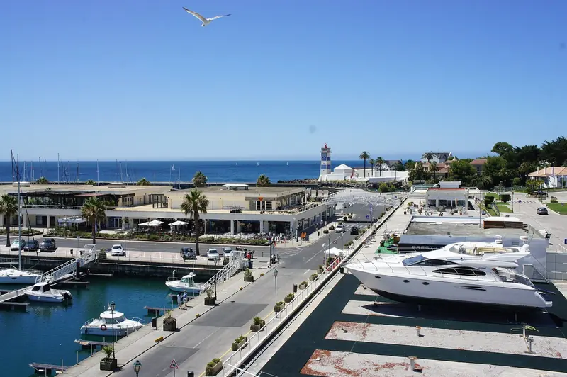 Motor yachts on the outer quay in front of the marina buildings. The larger berths are all on this side.