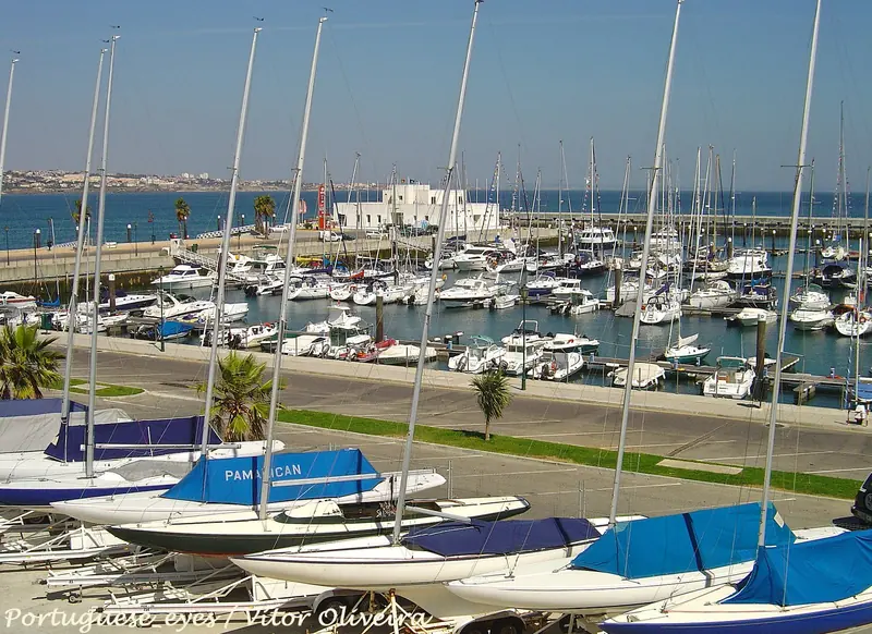 Dinghies and keelboats ashore beside the pontoons, the club fleet that uses this water all year.
