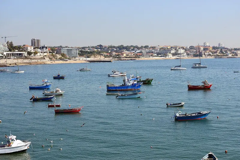 The bay outside the marina with the working boats on their moorings. This is the water an arriving yacht crosses, and it is open to the southwest.