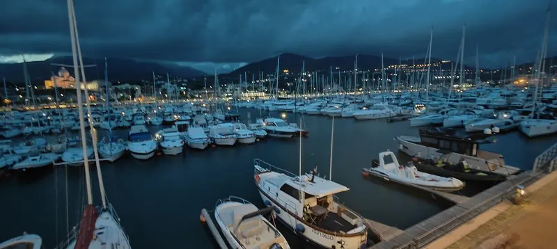 Marina di Loano from the promenade, the Chiesa di Nostra Signora del Monte Carmelo behind the berths.