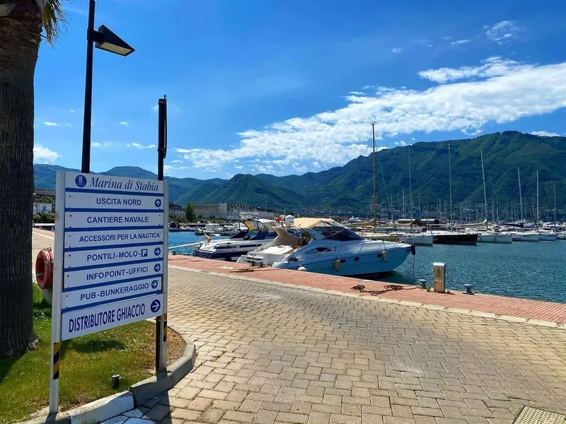 Wayfinding signage on the quay, pointing to the north exit, the shipyard, the finger piers and the ice dispenser