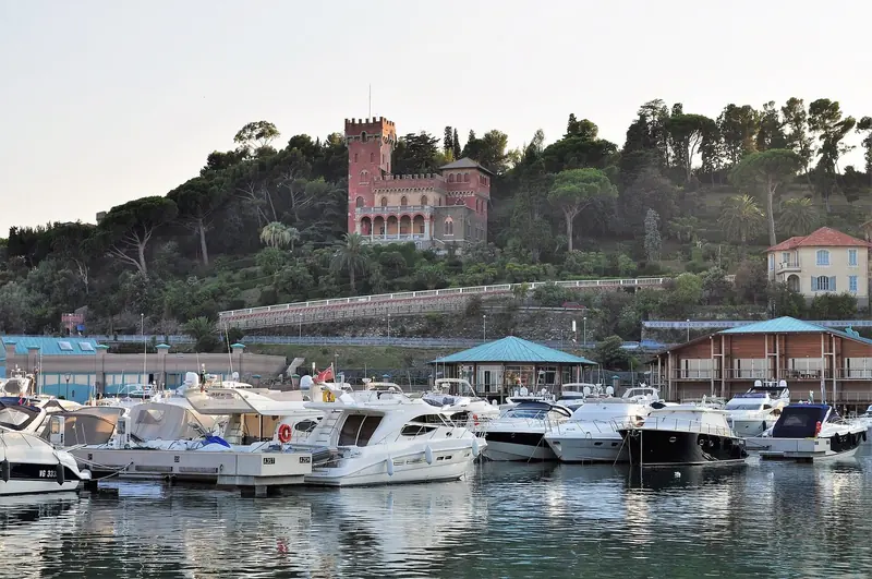 The 19th-century Castello di Varazze looks down over the marina from the pine-covered hill behind it.