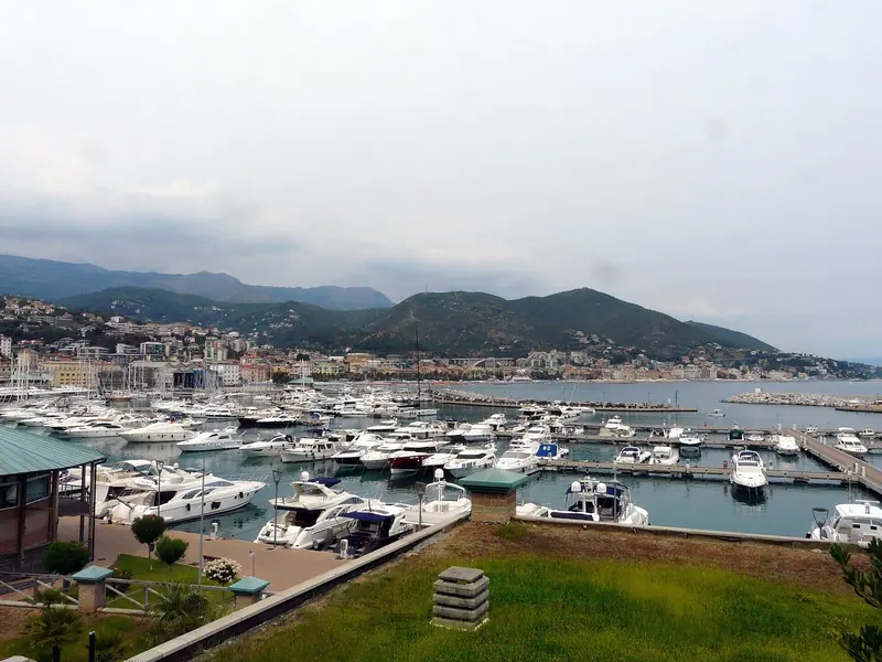 Hundreds of berths fill the basin, with the town of Varazze itself climbing the hillside beyond.