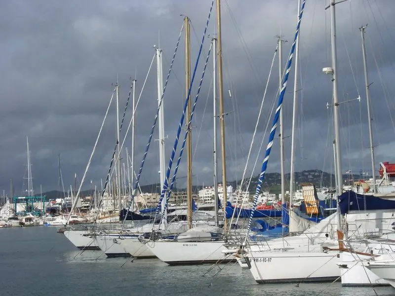 Alongside on the town quay a large motor yacht takes a berth where the walk into the old town starts at the passerelle.