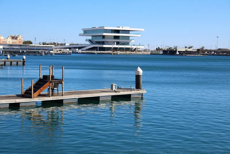 A finger pontoon in the T-Dock superyacht basin at Marina Real Juan Carlos I, with Veles e Vents behind.