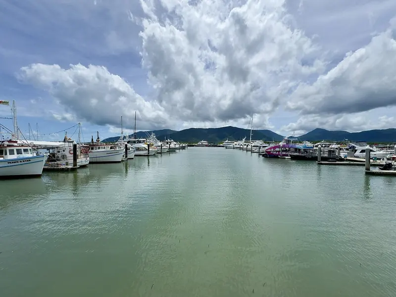 Marlin Marina at Cairns, the pontoons running out into Trinity Inlet with the ranges behind the town. This is the last real marina before the Reef.