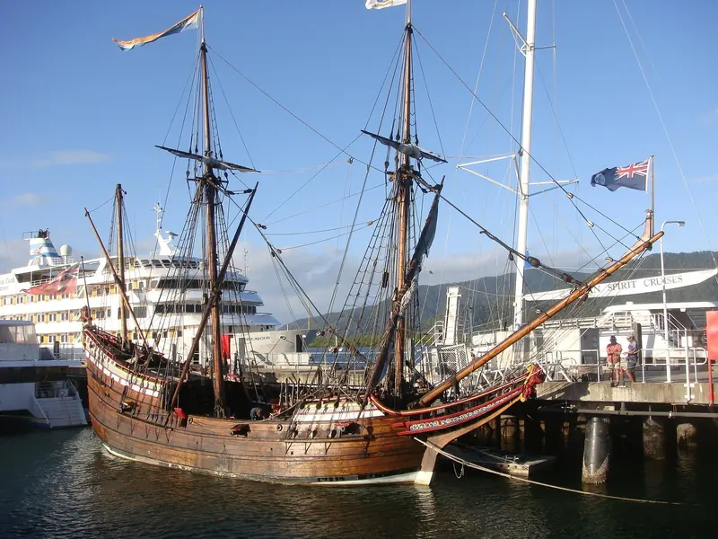 A tall ship and a cruise ship at the Cairns wharves next to the marina. The port is shared with commercial and expedition traffic.
