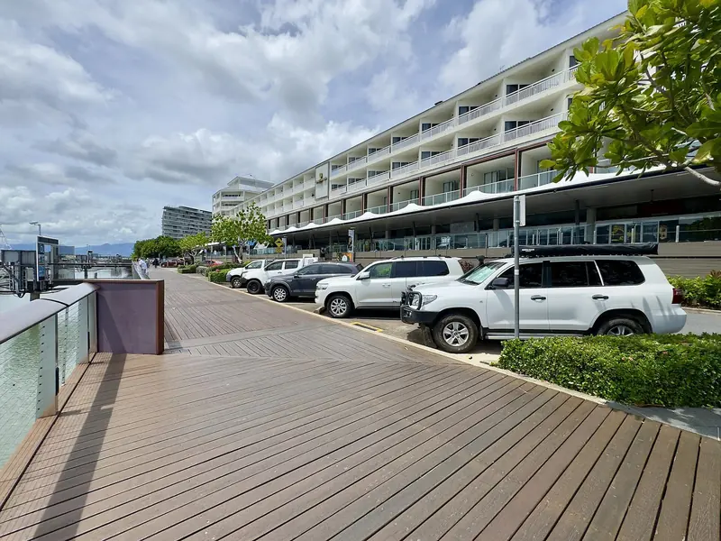 The boardwalk along the marina, with the hotel that fronts it. You walk off the pontoon into the middle of Cairns.