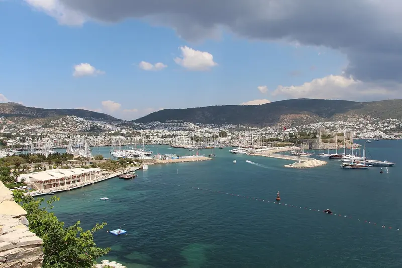 The bay and the marina from above, with the peninsula running west behind it.