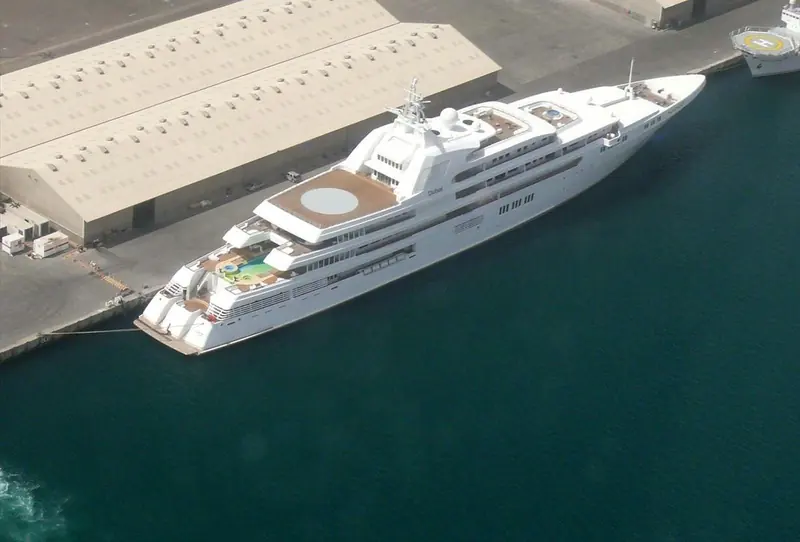 Dubai seen from above at her covered berth, the pool deck and helipad visible on the sundeck.