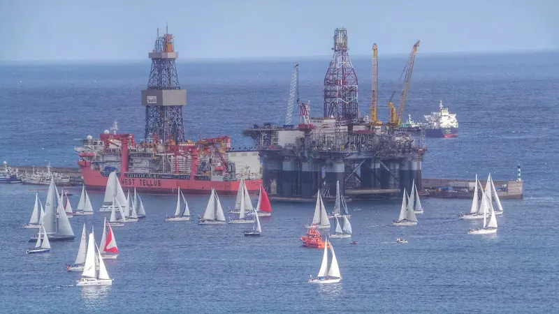 The ARC fleet sails past a laid-up drilling rig on its way out of Las Palmas at the start of the 2014 rally, one of 180 boats from 29 countries that year.