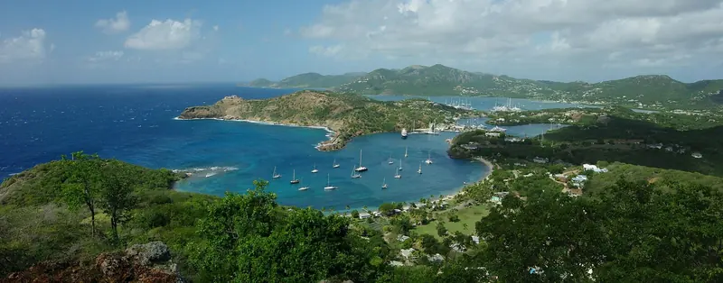 English Harbour from Shirley Heights, the view that shows why the Royal Navy chose this bay in 1725: hidden from open water and sheltered from hurricanes.