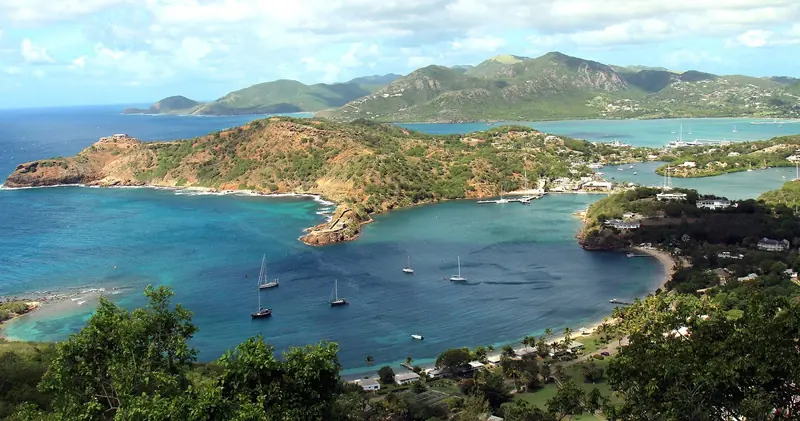 Yachts at anchor in English Harbour, seen from the heights above.