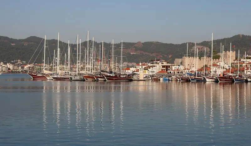 The Marmaris waterfront and its gulet fleet seen from the water.