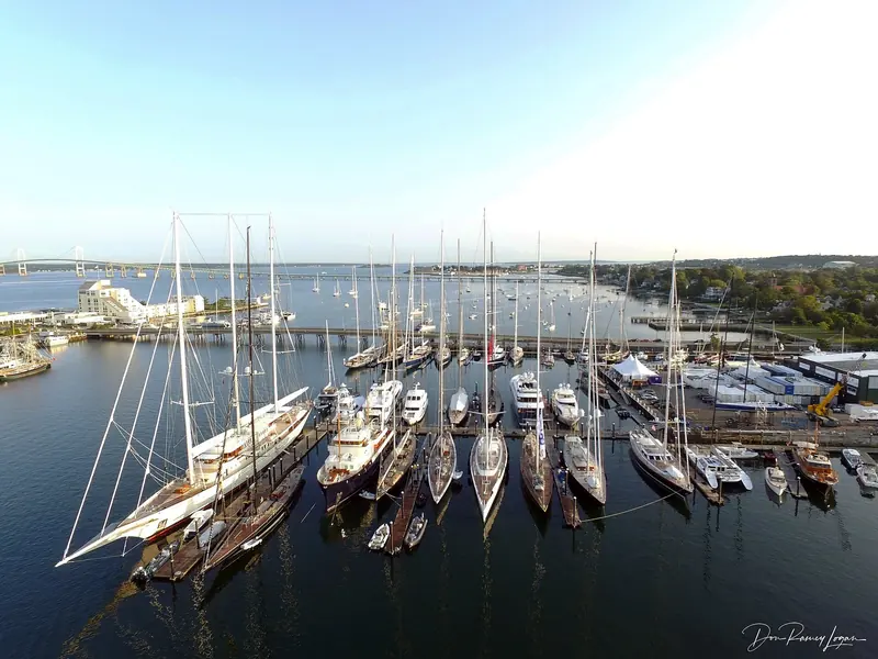 Newport Shipyard. Sailing yachts lie on the yard's own docks, with the sheds and the lifts directly behind them, which is the point of the place.