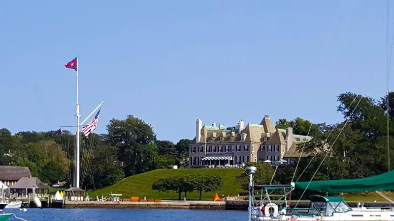 Harbour Court, the New York Yacht Club station above the harbour. Newport's racing calendar runs out of buildings like this one.