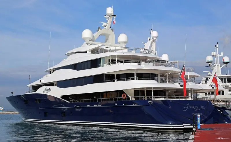 A blue-hulled superyacht takes the outside berth with another large motor yacht just astern of her, the kind of length this quay is set up to handle.