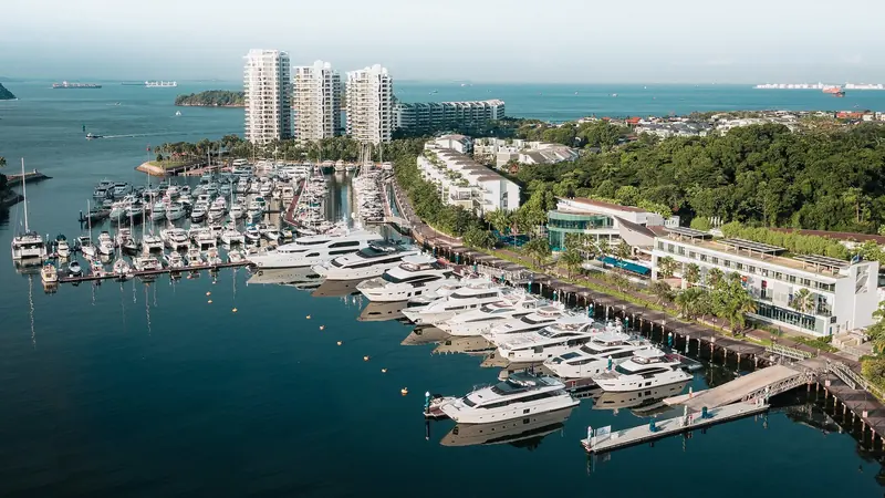 Berths run the length of the cove under the apartment blocks, minutes from the open strait.