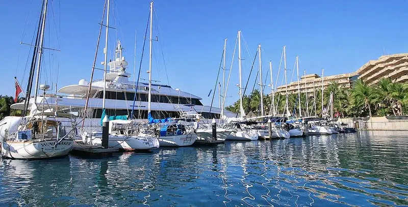Sailing yachts on their berths, the smaller end of a marina built to also take megayachts on its outer docks