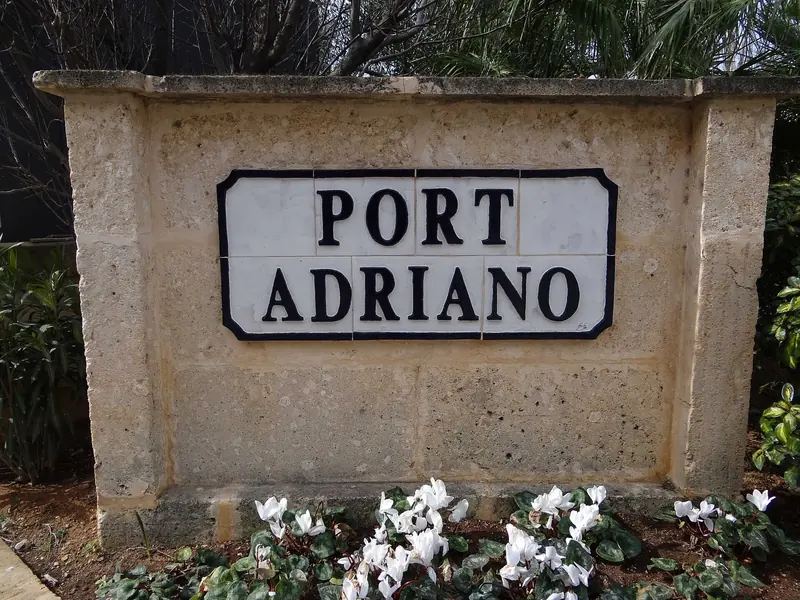 The entrance sign on the approach road. The marina sits on its own away from any town, which is a feature for some owners and a problem for others.