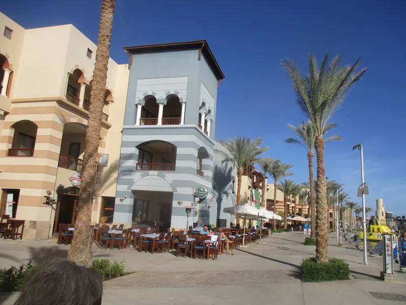 The harbour promenade at Port Ghalib. The marina village behind it is the only town most arriving crews ever walk through.
