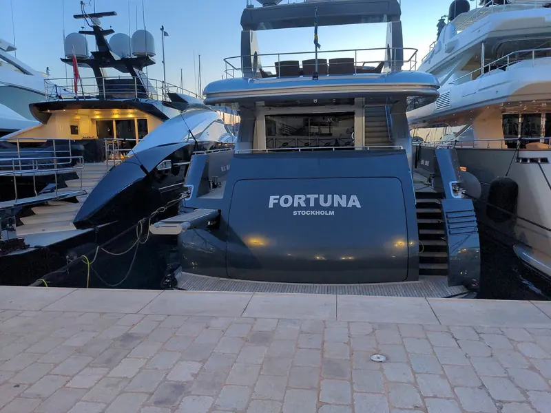 A Swedish-flagged motor yacht alongside at Cannes. Boats of this size take the outer quays; the inner pontoons carry the small craft.