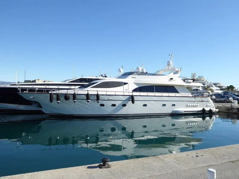 Motor yachts along the inner quay on a still morning.