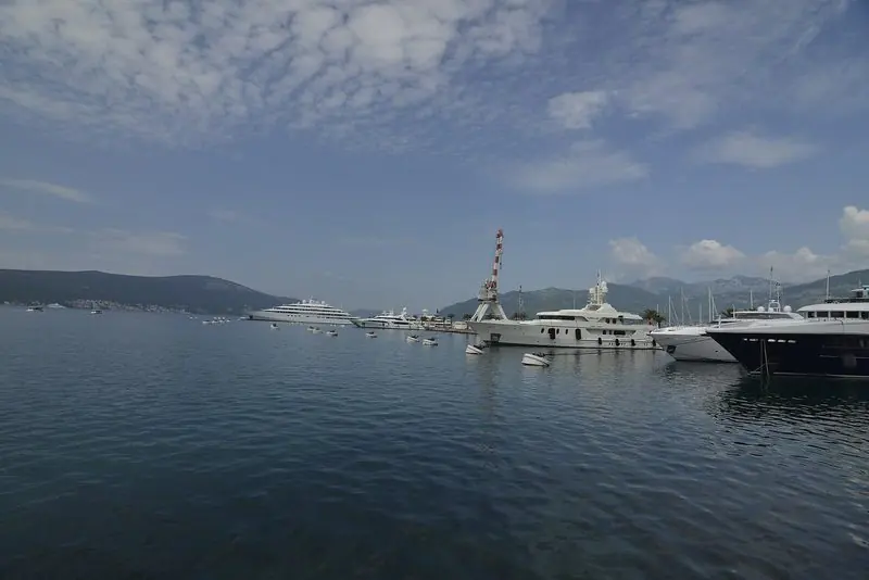 Yachts lying in flat water, the shelter that draws owners to this bay.