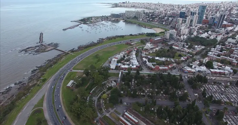 Puerto del Buceo and Montevideo's Rambla seen from above, with the yacht club basin curving into the bay.