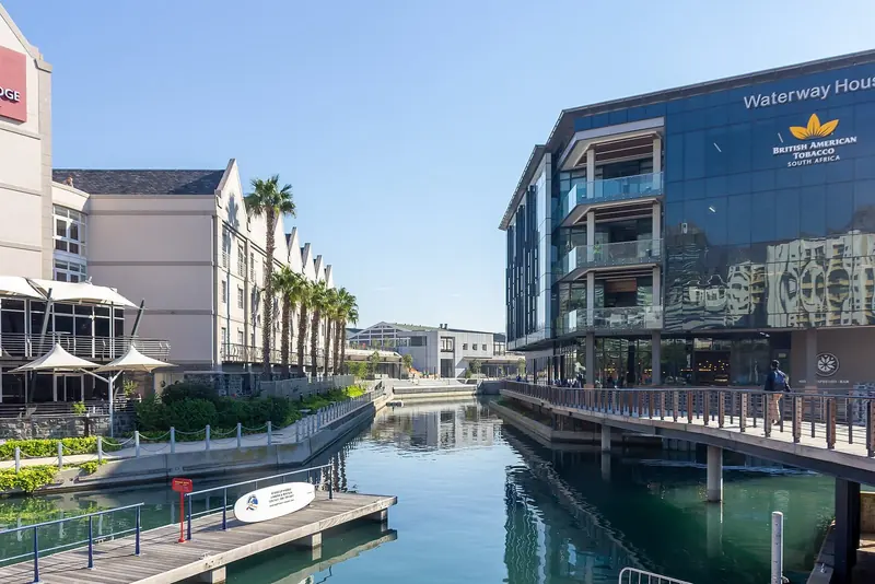 Waterway House on the Waterfront's internal canal, the kind of berth-side development that has driven demand for a dedicated superyacht basin at Quay 7.