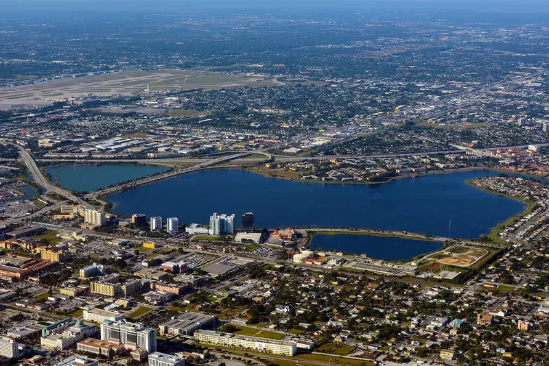 West Palm Beach from the air, with Clear Lake behind the city. The yard sits on the Intracoastal north of downtown.