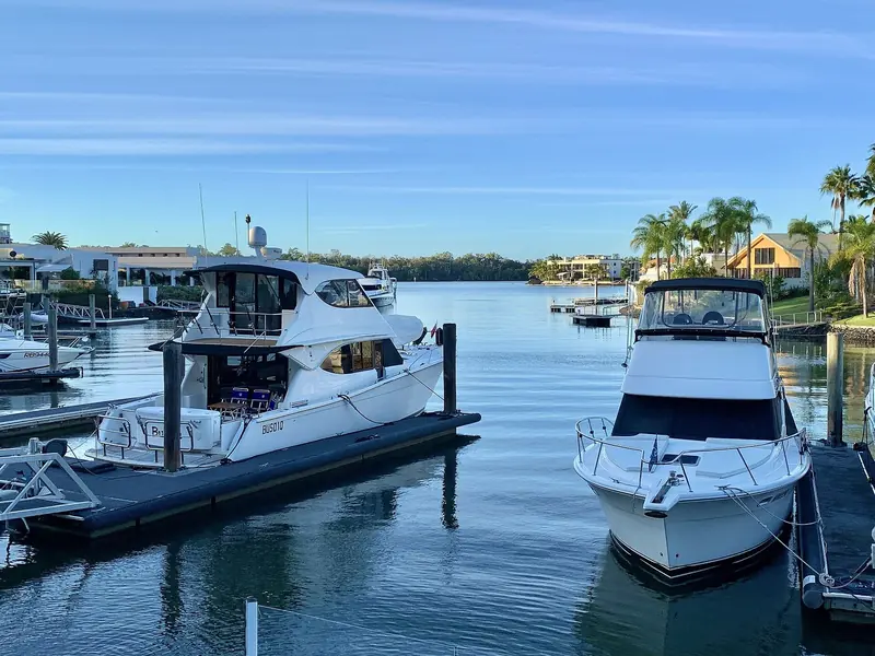 Motor yachts at the marina at blue hour. Most of what lies here is in the 15 to 25 m range.