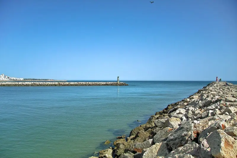 The mouth of the Ribeira de Quarteira beside the marina. The Atlantic entrance is the part of Vilamoura that needs planning, not the berth.