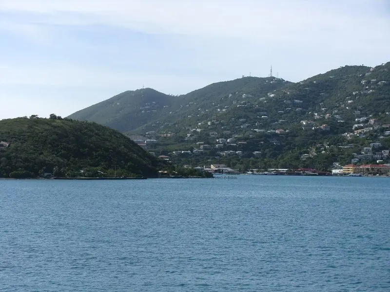 Low green headlands frame the entrance to Charlotte Amalie harbour, a short run in from open Caribbean water to fully sheltered berths.