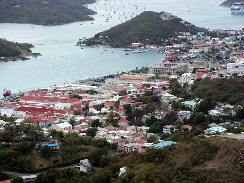 From the hills above town the whole harbour opens out, with the yacht quays on the far shore and the mooring field running away beyond them.