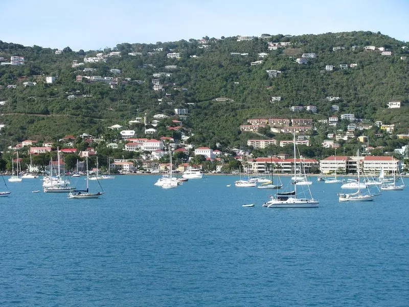 Charlotte Amalie runs along the shoreline below a steep green ridge, the harbour wide enough to take a large anchored fleet without crowding the quays.