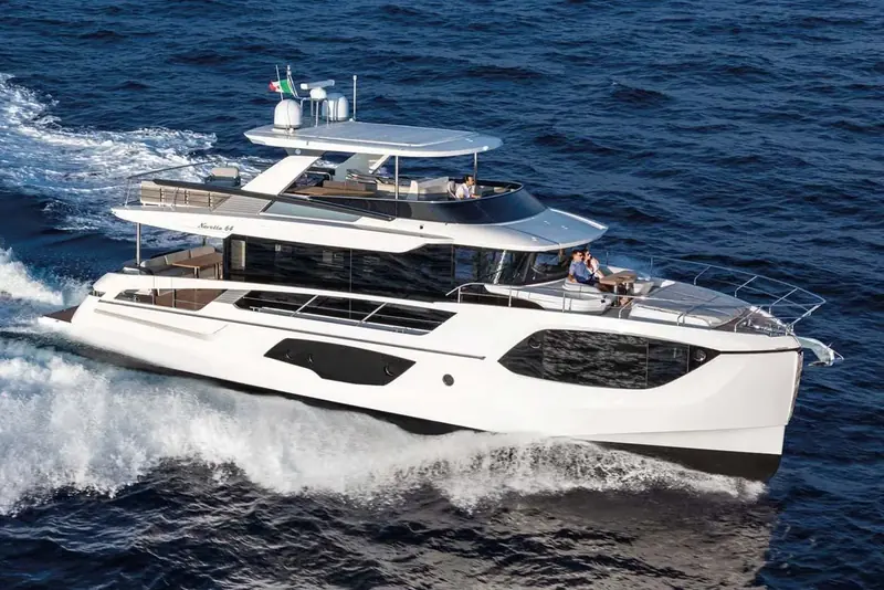 The Navetta 64 under way at speed, showing its semi-displacement hull is capable of planing rather than only trawler speeds.