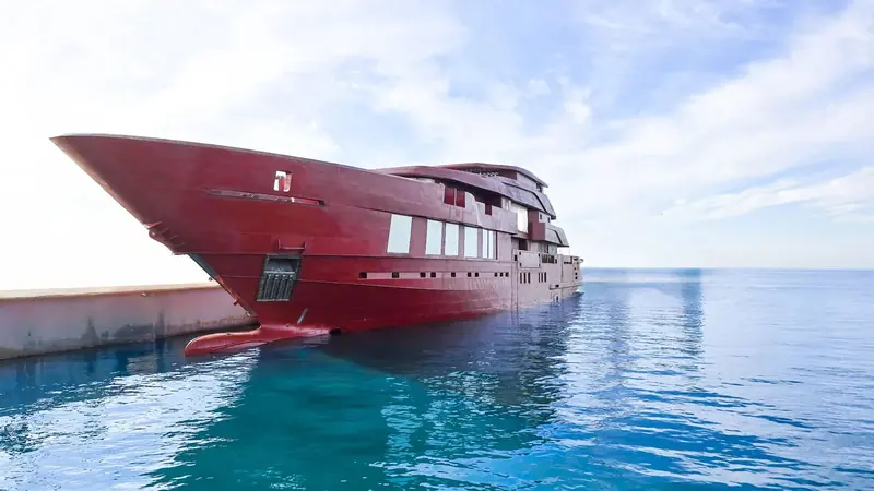The Admiral 70-metre (project C.615) hull in red oxide primer during outfitting at Marina di Carrara, the yard's own real progress photograph rather than a sales render, ahead of a planned 2028 delivery.