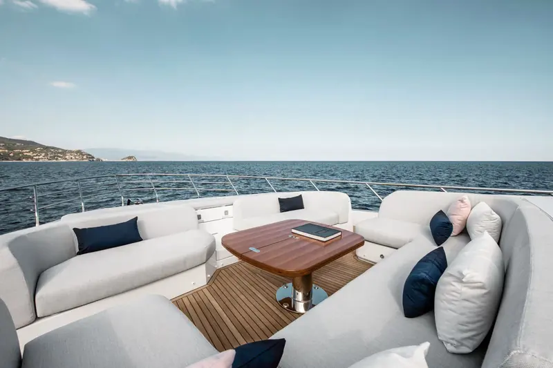 Flybridge aft seating with a full wraparound settee - one of three separate social decks on the boat alongside the cockpit and foredeck.