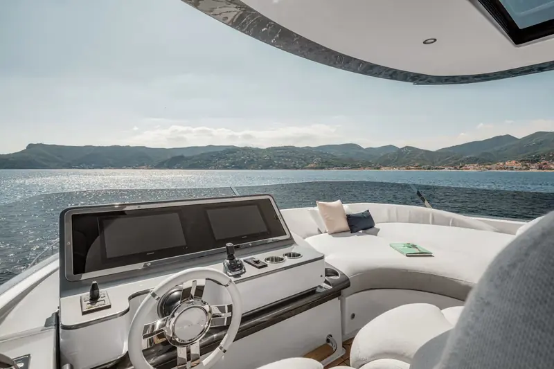 The lower helm, with the triple Volvo Penta IPS joystick visible beside the wheel - the control that does the close-quarters docking work on this boat.
