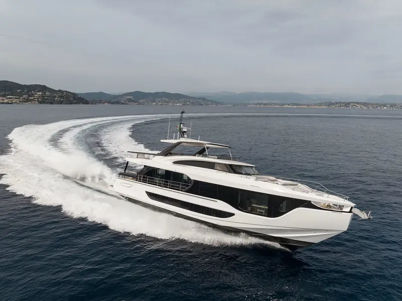 A second running pass off the French Riviera, this time with the hills of the Esterel massif behind - the carbon-lightened superstructure keeping the sheerline low for a boat in the superyacht bracket.