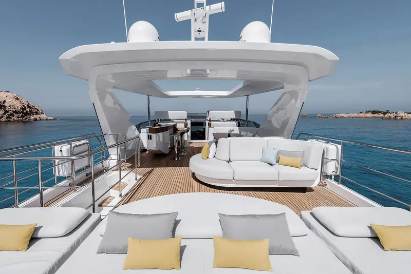 The flybridge lounge, forward-facing seating built around the helm rather than a separate sunbathing area.