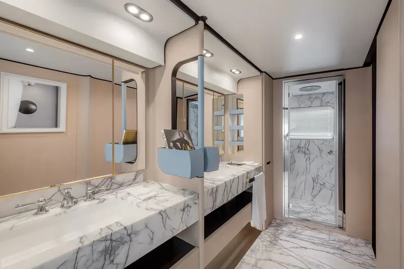 One of the guest bathrooms, finished in book-matched marble running floor to counter.