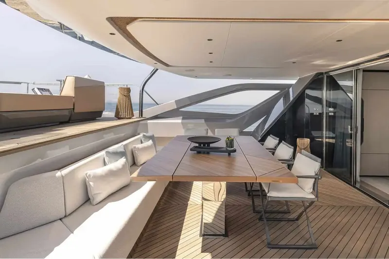 The forward upper-deck lounge and its own aft-facing sofa circle, a second entertaining area distinct from the main aft dining terrace one deck below.