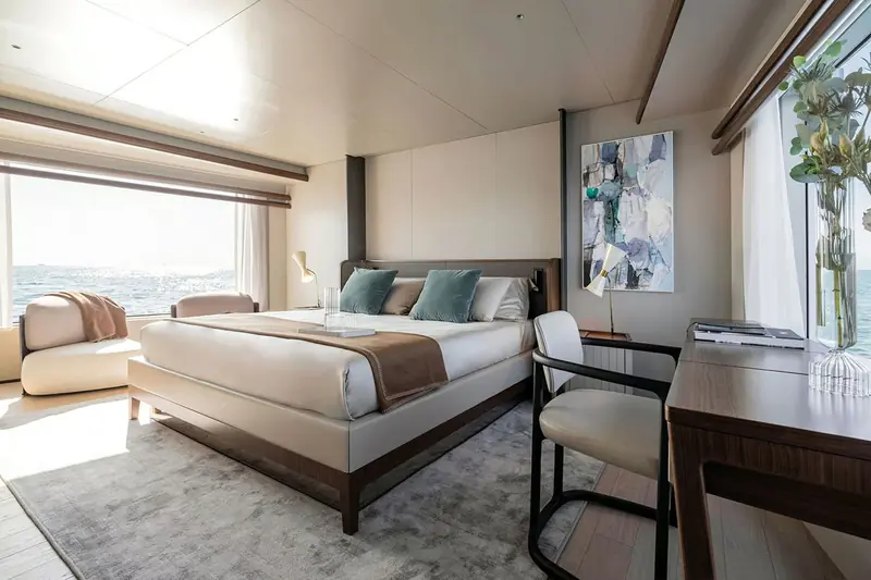 One of the guest cabins, a centreline double with a writing desk rather than the built-in sofa some yards substitute.