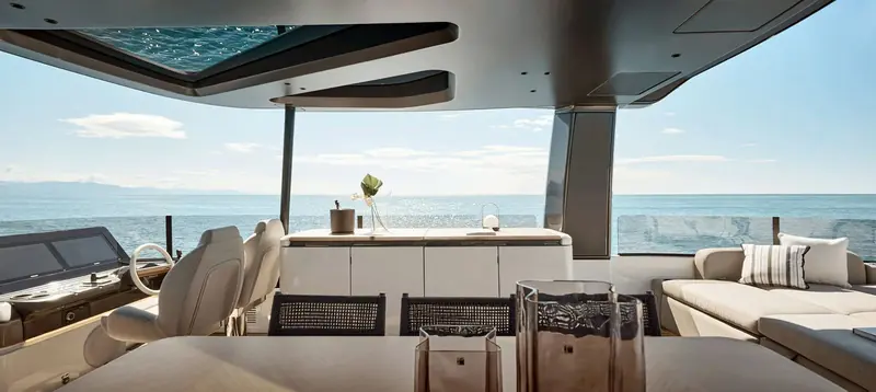 The helm and saloon looking aft: Matteo Thun and Antonio Rodriguez kept the glazing low and horizontal so the water stays in view from inside.
