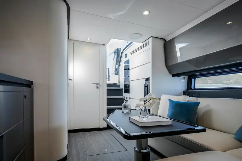 The cabin below the cockpit sole, a compact dinette and heads rather than full cruising accommodation, in keeping with the day-boat brief.