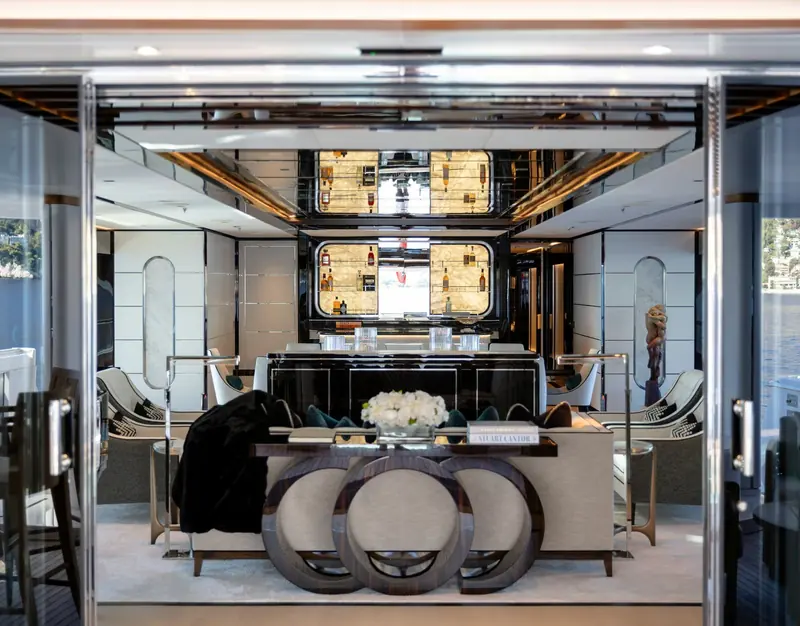 The main-deck bar and lounge, with mirrored cabinetry and a circular banquette.
